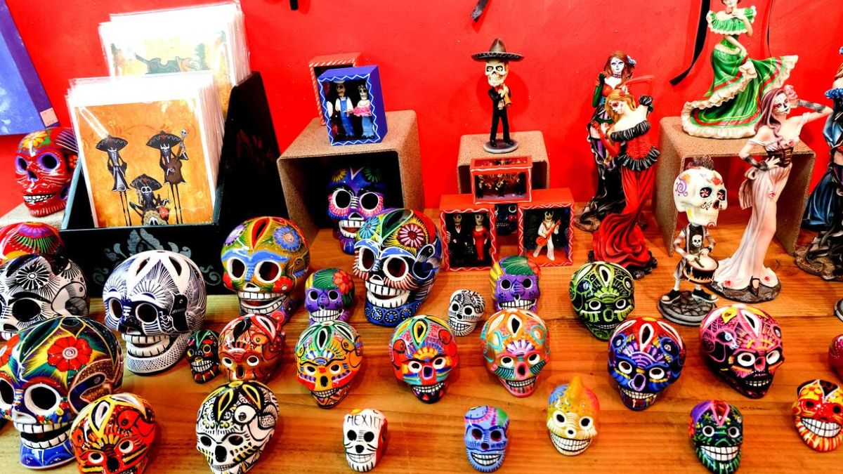 A display of colorful traditional Mexican crafts, decorative skulls, and souvenirs in San Ysidro, highlighting quality and authenticity