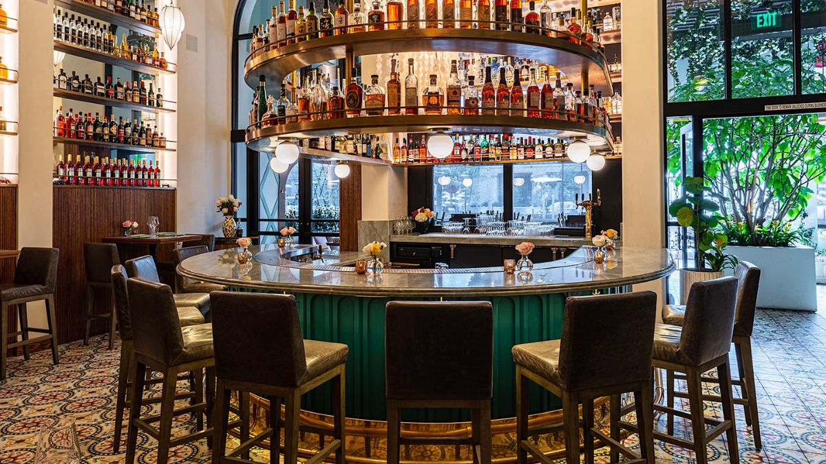 An inviting restaurant interior showcasing comfortable seating arrangements and a curved bar, helping families evaluate venue layouts and options in San Ysidro.