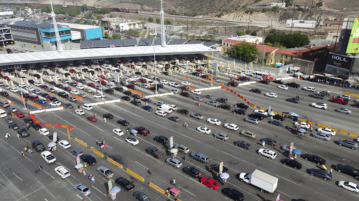 Aerial view of heavy vehicle traffic lined up at the San Diego-Tijuana border crossing lanes for travelers heading to medical appointments.