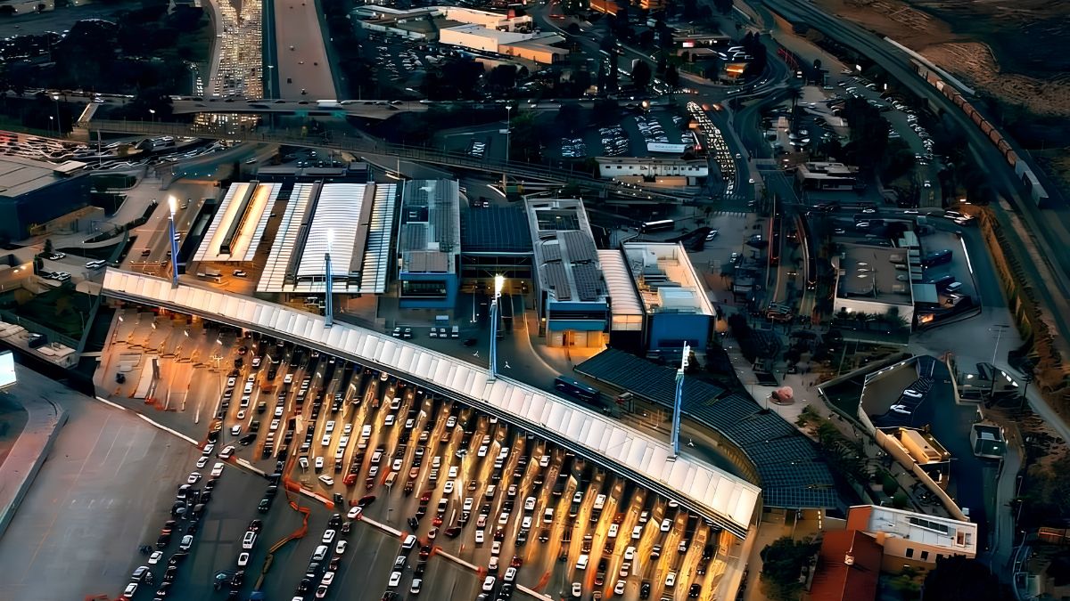 Aerial nighttime photograph of the extensive vehicle lanes and inspection facilities at the San Ysidro border crossing