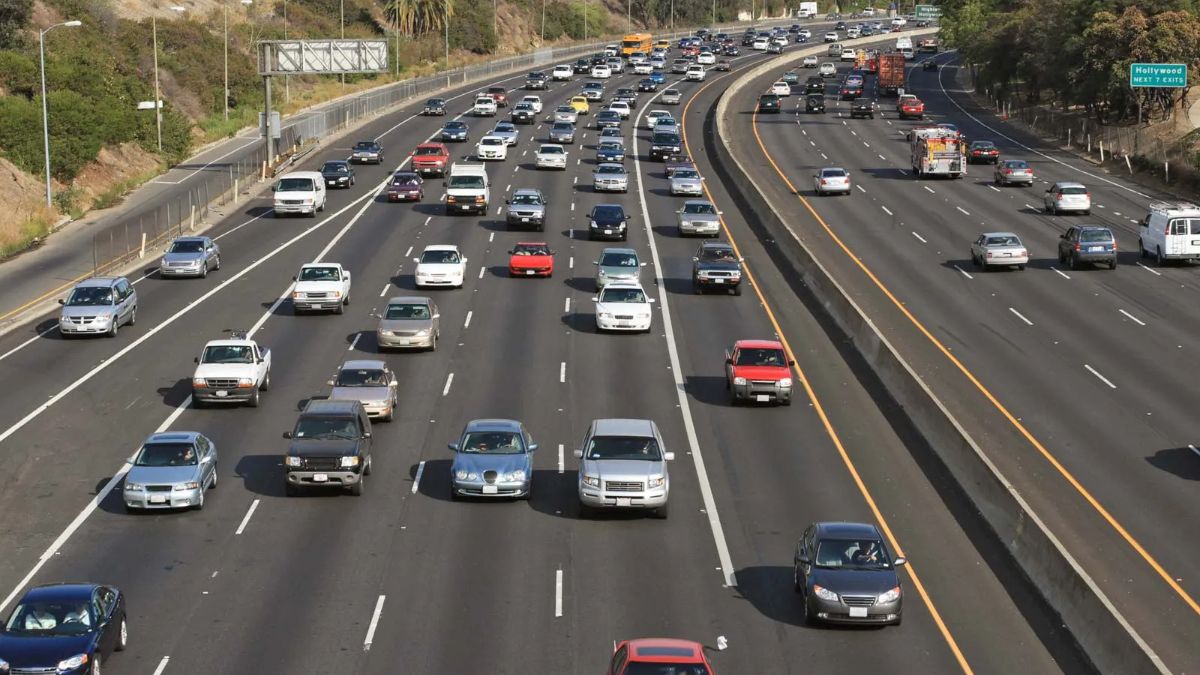 Elevated view of heavy traffic flowing across multiple lanes of a busy freeway