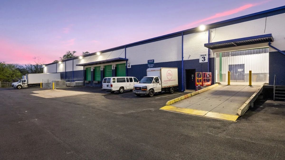 Exterior view of a commercial property and warehouse with loading docks in San Ysidro