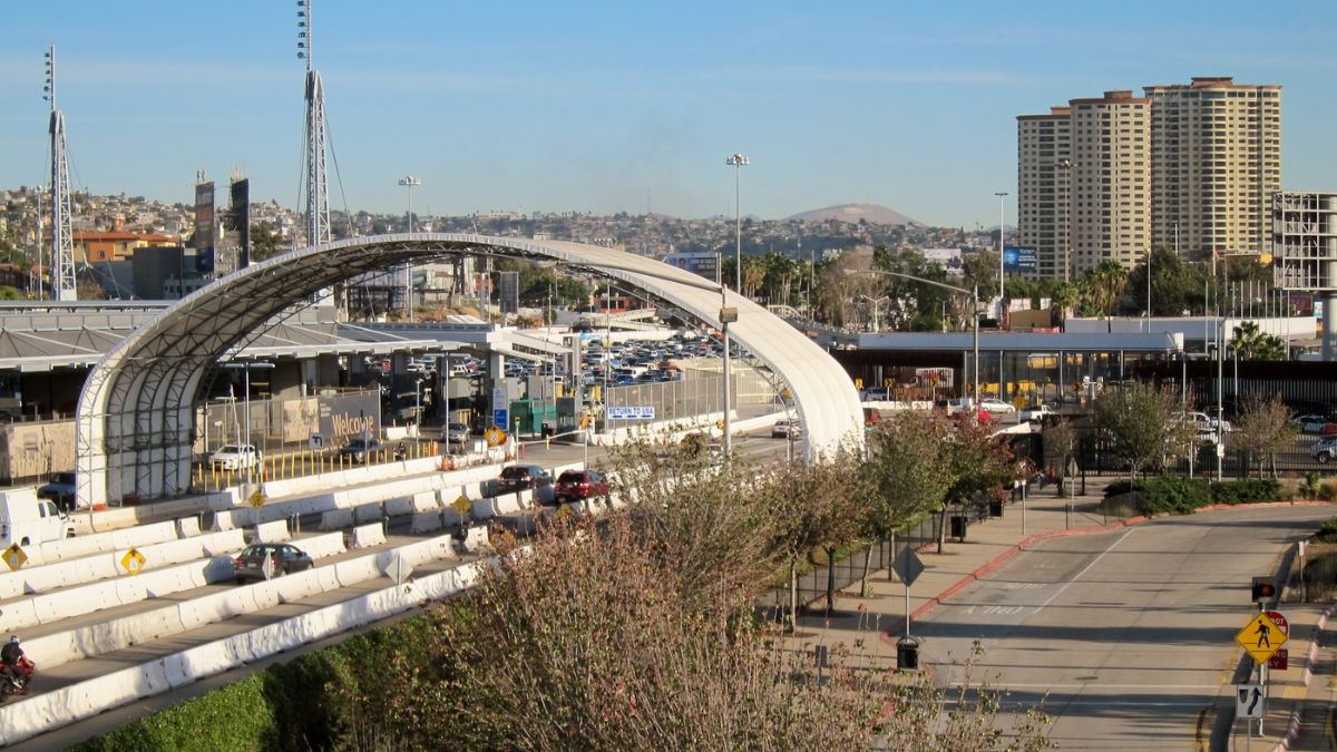 A wide-angle view of San Ysidro streets, commercial structures, and public spaces near the border crossing, illustrating local history and infrastructure